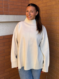 MOCK NECK FRONT SEAM SWEATER