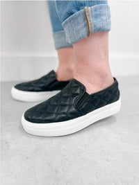 THE POUCH BLACK QUILTED SLIP ON SHOE